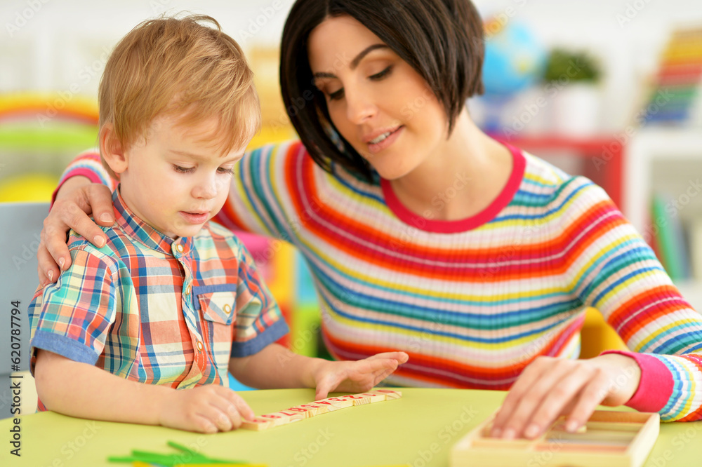 Young mother and cute little son playing Young mother and cute little son playing