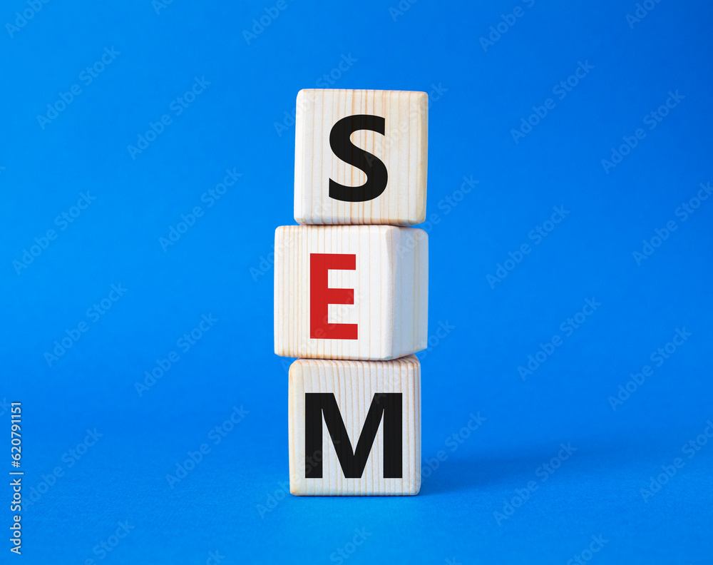 SEM - Search Engine Marketing symbol. Wooden cubes with words SEM. Beautiful blue background. Business and SEM concept. Copy space. SEM - Search Engine Marketing symbol. Wooden cubes with words SEM. Beautiful blue background. Business and SEM concept. Copy space.