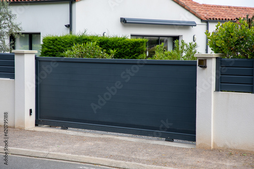door gray gate steel big grey dark metal sliding electric portal fence on modern house street