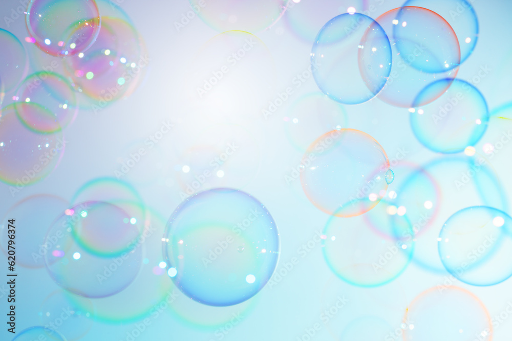 Beautiful Transparent Blue Colorful Soap Bubbles Floating in The Air. Soap Sud Bubbles Water. Abstract Background	
