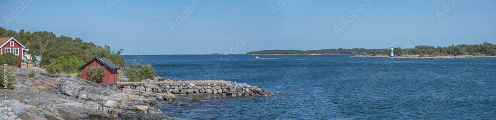 Island, skerries and islet, in the middle part of the archipelago, summer houses, boat sheeds, jetties. skyline ocean horizon, a sunny summer day in Stockholm Island, skerries and islet, in the middle part of the archipelago, summer houses, boat sheeds, jetties. skyline ocean horizon, a sunny summer day in Stockholm