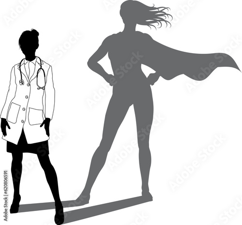 A superhero medical doctor woman health care worker revealed by her shadow silhouette as a super hero in a cape.