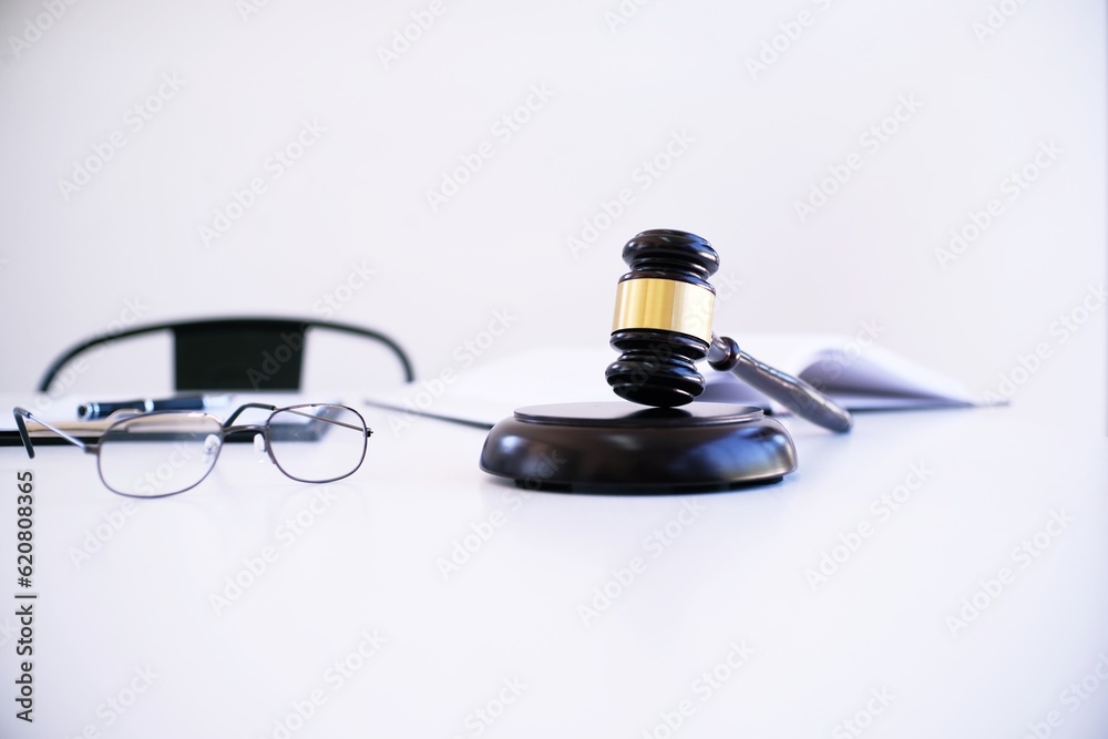 Female lawyer Legal counsel presents to the client a signed contract with gavel and legal law. justice and lawyer woman business concept . Female lawyer Legal counsel presents to the client a signed contract with gavel and legal law. justice and lawyer woman business concept .