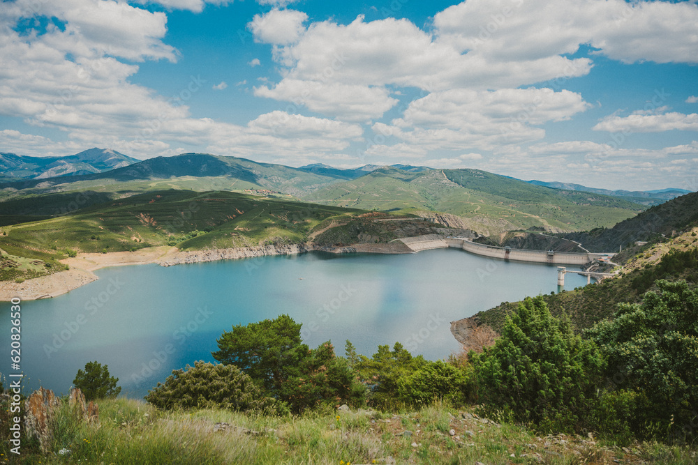 Scenic landscape of lake surrounded by mountains Scenic landscape of lake surrounded by mountains
