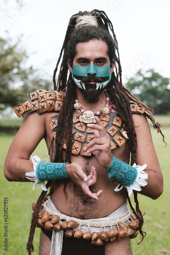 Indigenous man doing hand signs photo