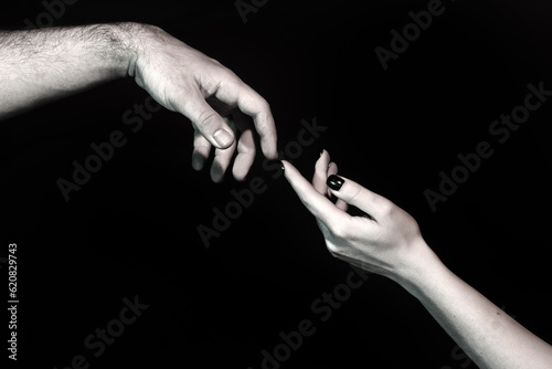 Touch of two hands. Man and woman hand about to touch with index finger. Couple in love reaching to each other. Hand try to touch. Couple hands reaching towards each other. Couple hand touch. © Volodymyr