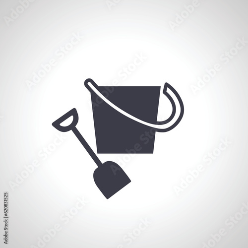 Sand bucket icon. sand bucket with shovel icon.