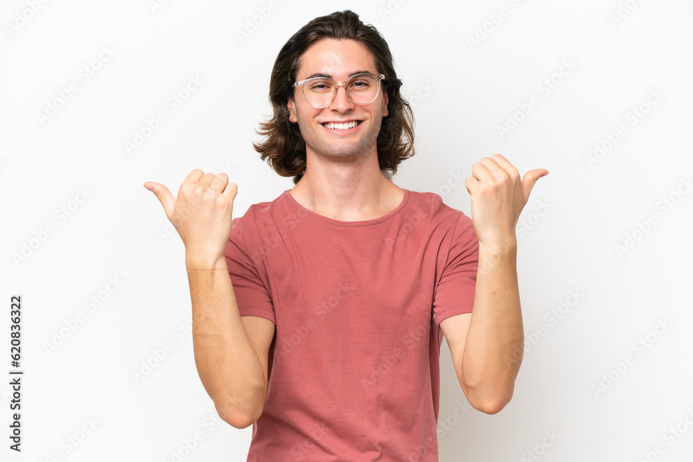 Young handsome man isolated on white background with thumbs up gesture and smiling Young handsome man isolated on white background with thumbs up gesture and smiling