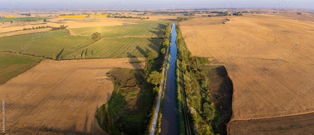 Enchanting Sunrise Over the Scenic Canal de Castilla: An Aerial Perspective