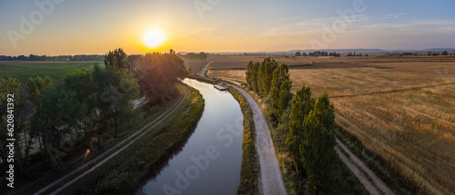 Obraz na płótnie Enchanting Sunrise Over the Scenic Canal de Castilla: An Aerial Perspective w salonie