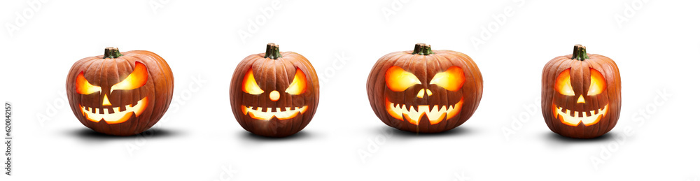 A collection of lit spooky halloween pumpkins, Jack O Lantern with evil face and eyes isolated against a transparent background. - obrazy, fototapety, plakaty 