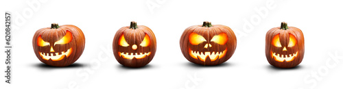Obraz na płótnie A collection of lit spooky halloween pumpkins, Jack O Lantern with evil face and eyes isolated against a transparent background. w salonie