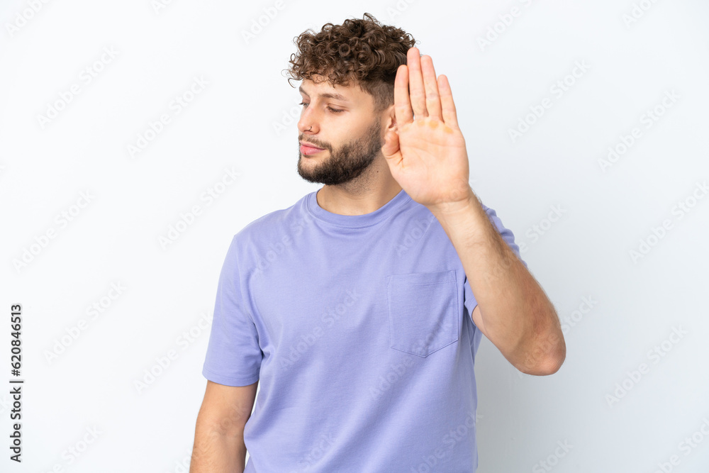 Young handsome caucasian man isolated on white background making stop gesture and disappointed Young handsome caucasian man isolated on white background making stop gesture and disappointed