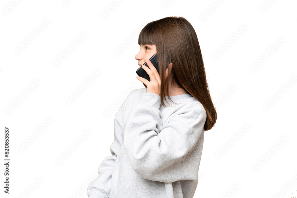 Little girl over isolated green chroma key background keeping a conversation with the mobile phone with someone Little girl over isolated green chroma key background keeping a conversation with the mobile phone with someone