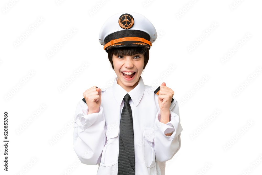 Little girl as a Airplane pilot over isolated chroma key background celebrating a victory in winner position