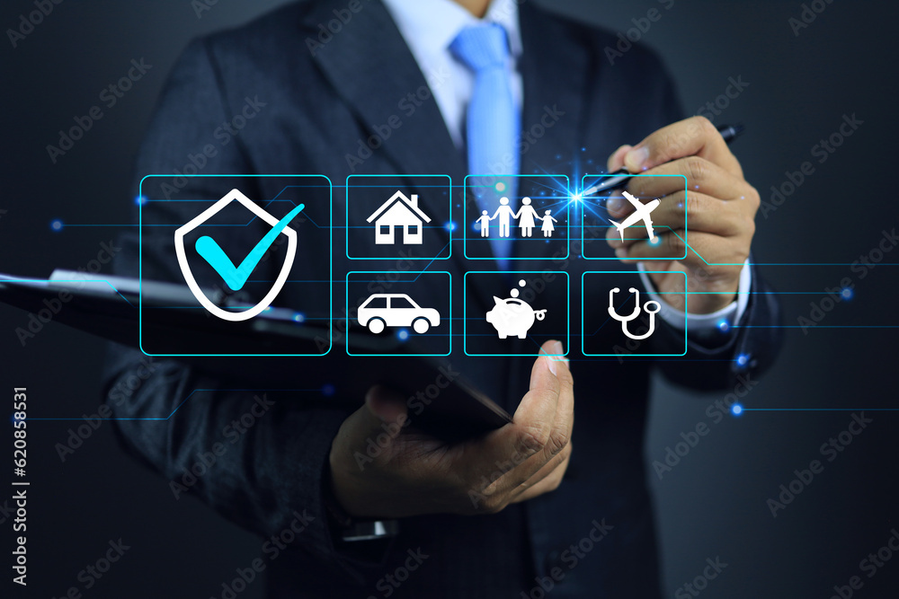 Φωτογραφία Businessman clipboard writing on life insurance program to choose a plans such as travel healthy car child money and home