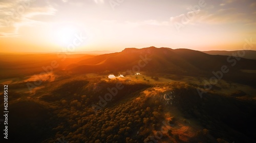 空撮した夕日に染まる山並みのイメージ Generative AI