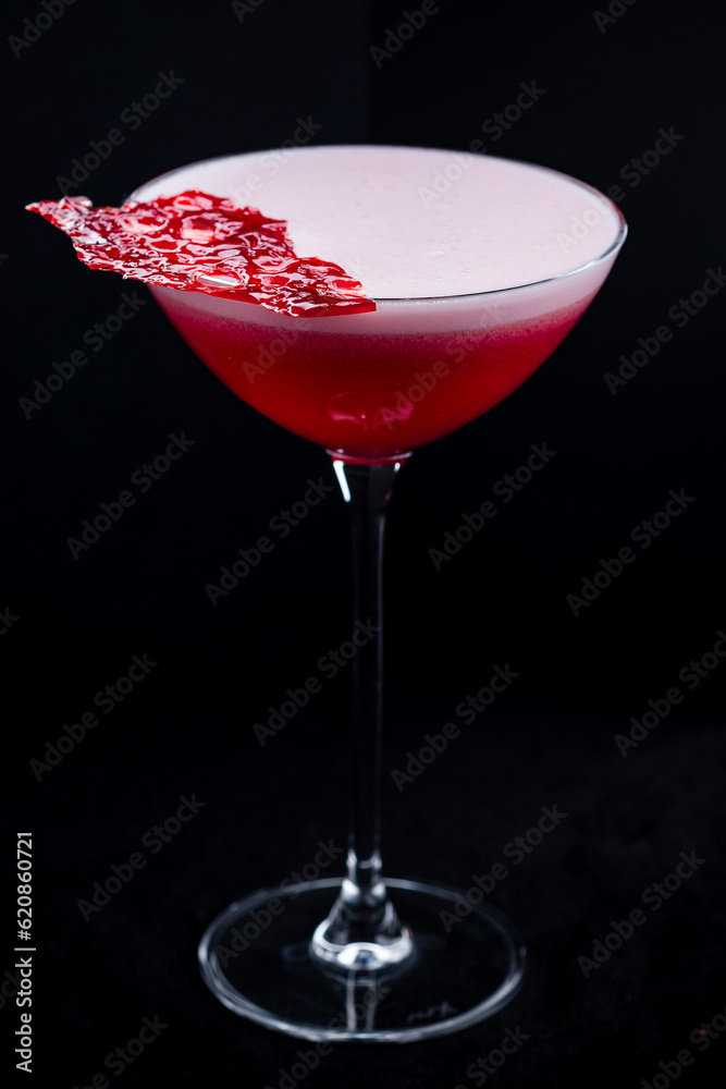 Strawberry daiquiri made with white rum, strawberry syrup and lime juice.
