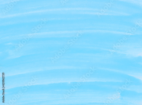 Abstract blue watercolor background. The color splashing on the paper. Hand drawn.