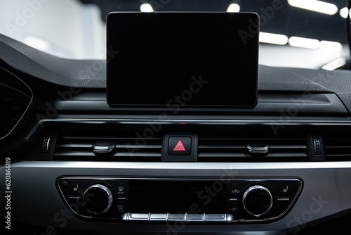 Obraz na płótnie Screen of the multimedia system in a modern car with space for advertising w salonie