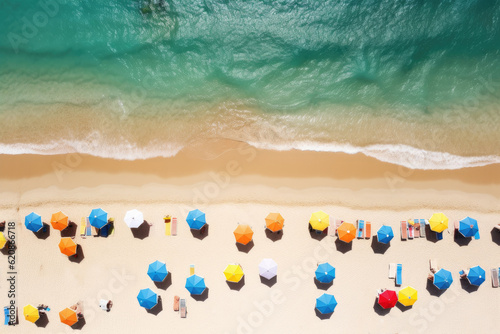 Aerial drone view of many colorful umbrellas on sand beach