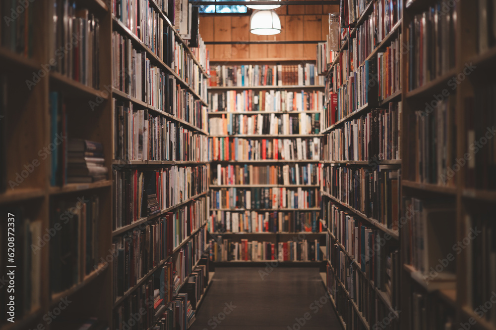 Library with many shelves and books, diminishing perspective and shallow dof