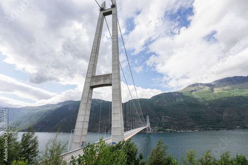 Hardanger Bridge is the longest suspension bridge in Norway. Hardangerbrua connecting two sides of Hardangerfjorden. Hardangerbrua bridge close to Ulvik in Western Norway