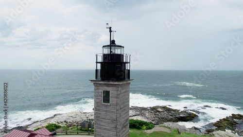 Aerial tour around the tower of Beavertail Lighthouse, Rhode Island photo