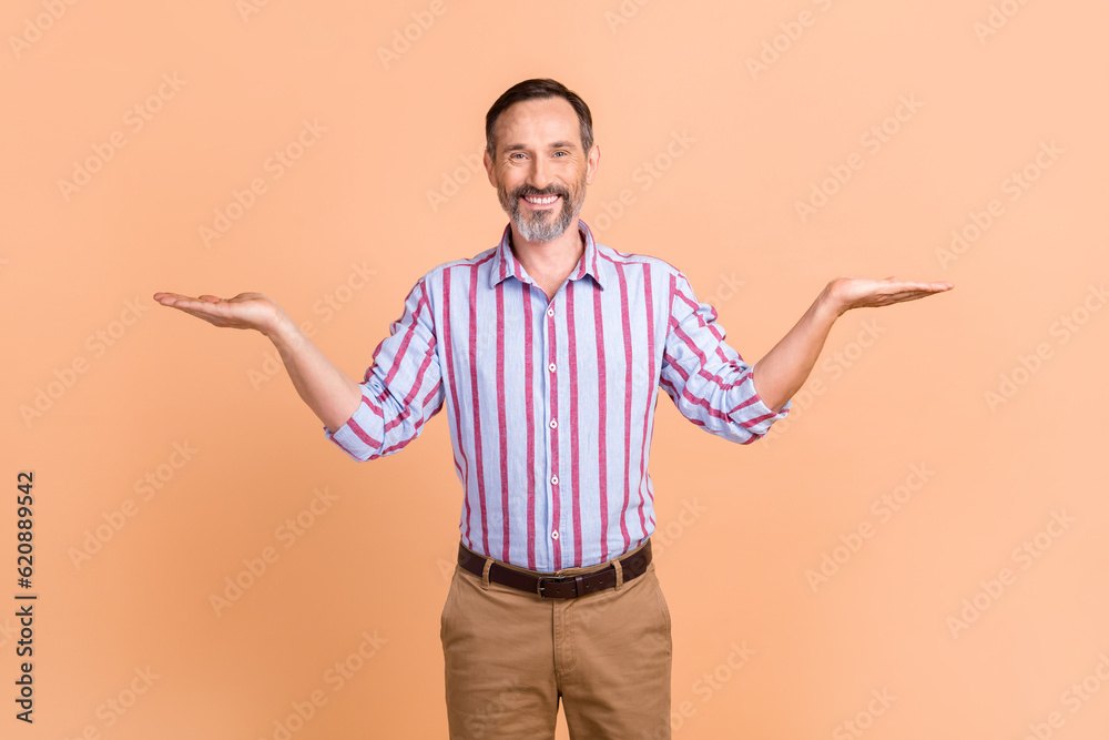 Portrait of handsome person with gray beard dressed colorful shirt arms presenting sale empty space isolated on pastel color background Portrait of handsome person with gray beard dressed colorful shirt arms presenting sale empty space isolated on pastel color background
