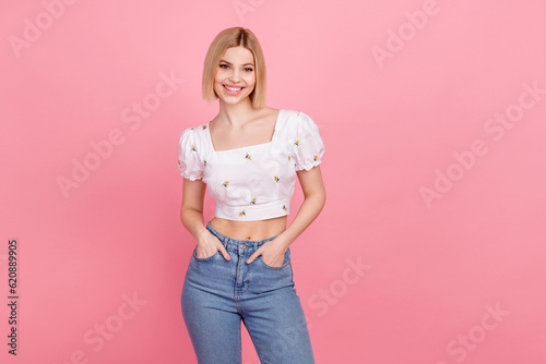 Photo of charming lady hold hands pockets sale season wear vintage shirt blue jeans isolated pastel pink color background