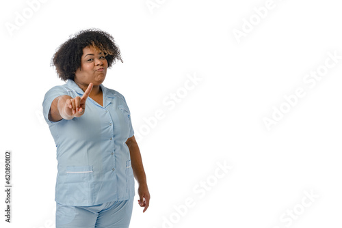 young Afro-Latin female doctor saying no with finger in front, white background with copy space photo