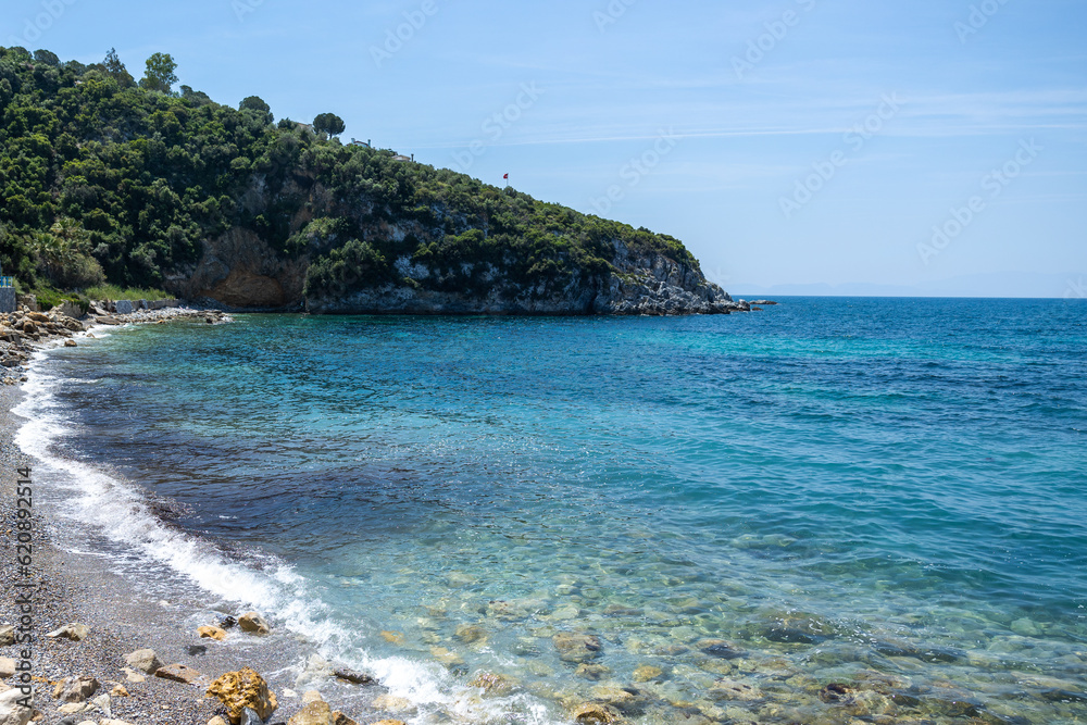 Blue bay of the mediterranean sea. Sun, green nature, blue water. Rest, vacation at sea.