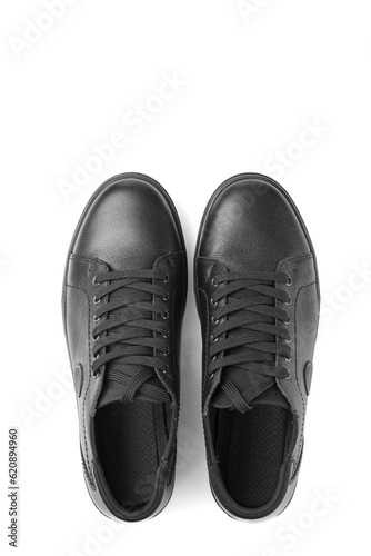 black leather sneakers on a white background