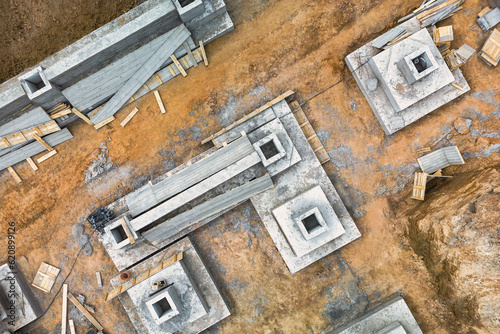Monolithic reinforced concrete foundations for the construction of a large building. Rostverk at the construction site. Construction pit with foundation. close-up. View from above.