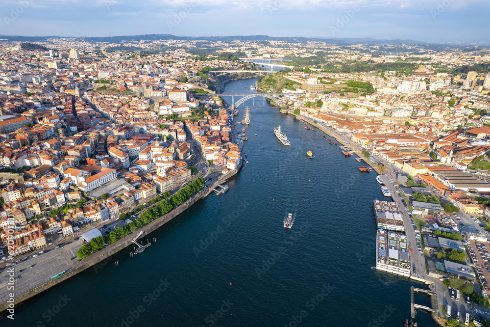 Obraz premium Porto, Portugal - Sunset aerial flyover above the Douro river and the city of Porto