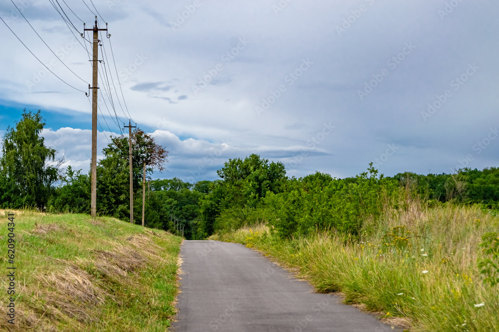 Beautiful empty asphalt road in countryside on colored background Beautiful empty asphalt road in countryside on colored background