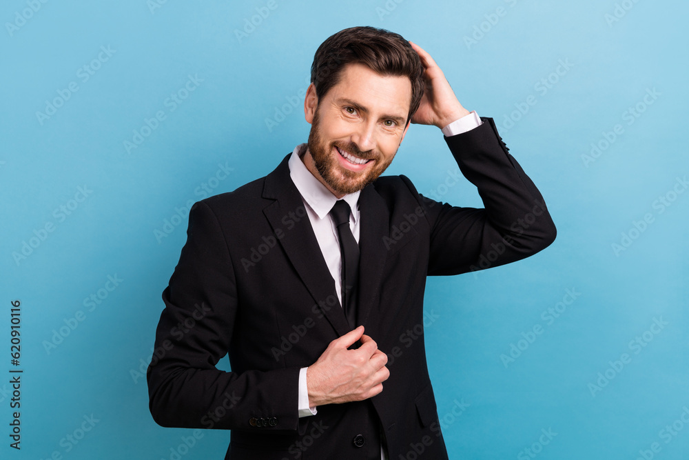 Photo of cheerful attractive man manager wear black tuxedo fixing hairdo isolated blue color background Photo of cheerful attractive man manager wear black tuxedo fixing hairdo isolated blue color background