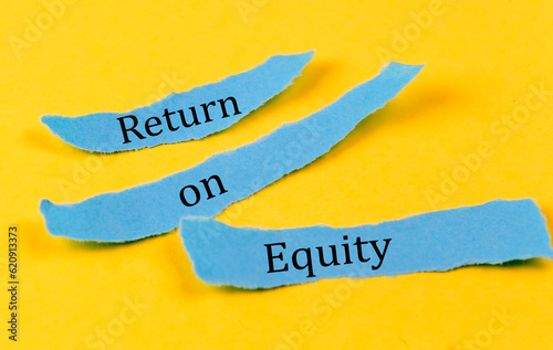 RETURN ON EQUITY text on a blue pieces of paper on yellow background, business concept