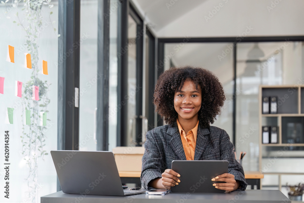 Young happy business woman working with tablet in corporate office Young happy business woman working with tablet in corporate office