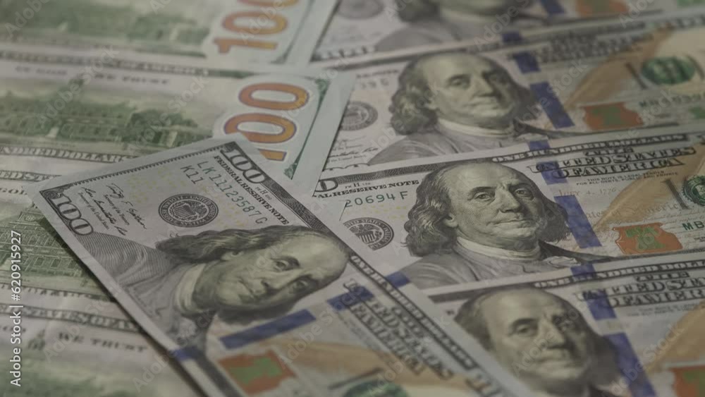 Flying Over Cash Money in 100 Dollar Bill Flying Over Cash Money in 100 Dollar Bill