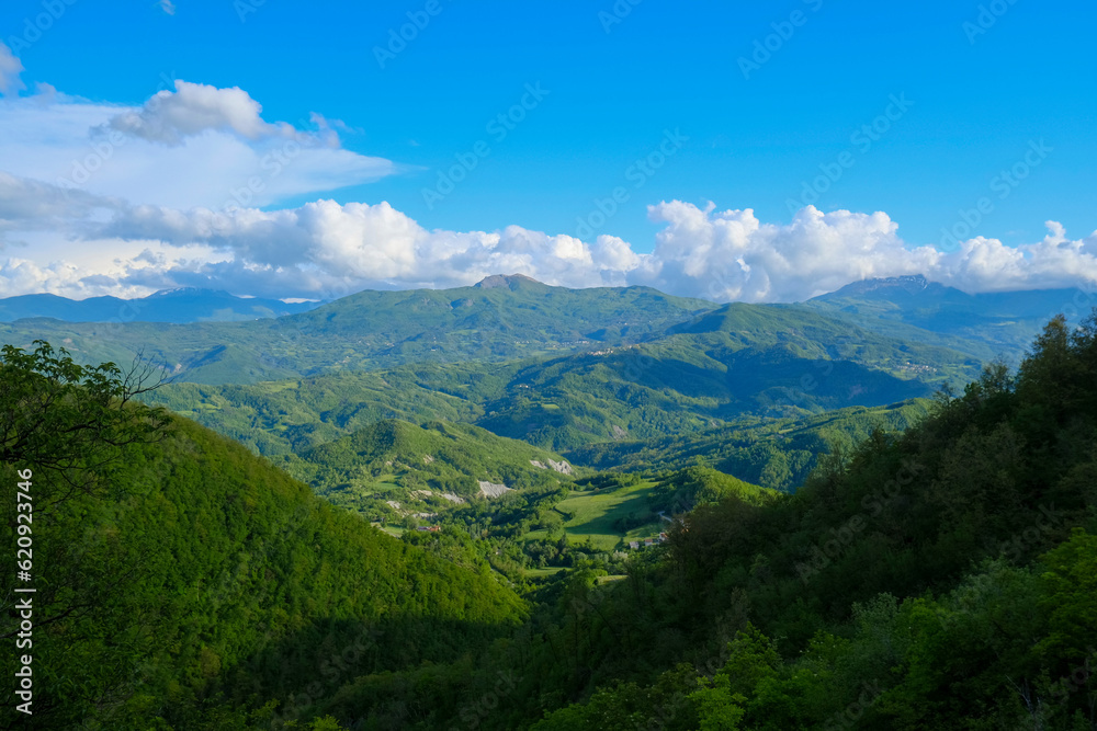 Aerial view of landscape with fields, mountains, woods, on sunset from Appennies Tosco-Emiliano national park Monte Fuso. natural background. Travel concept