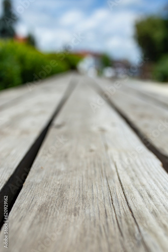 Parallel weathered wooden boards, product display backdrop, soft focus