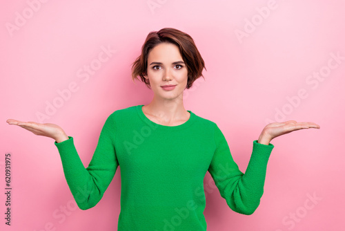 Fotografie Photo of young girl hands compare two products demonstrate best service for down