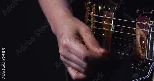 Hand Playing An Electric Guitar