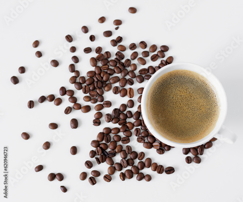 Top view of coffee cup and coffee beans on table