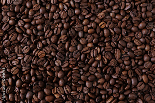 Top view background of aromatic brown coffee beans