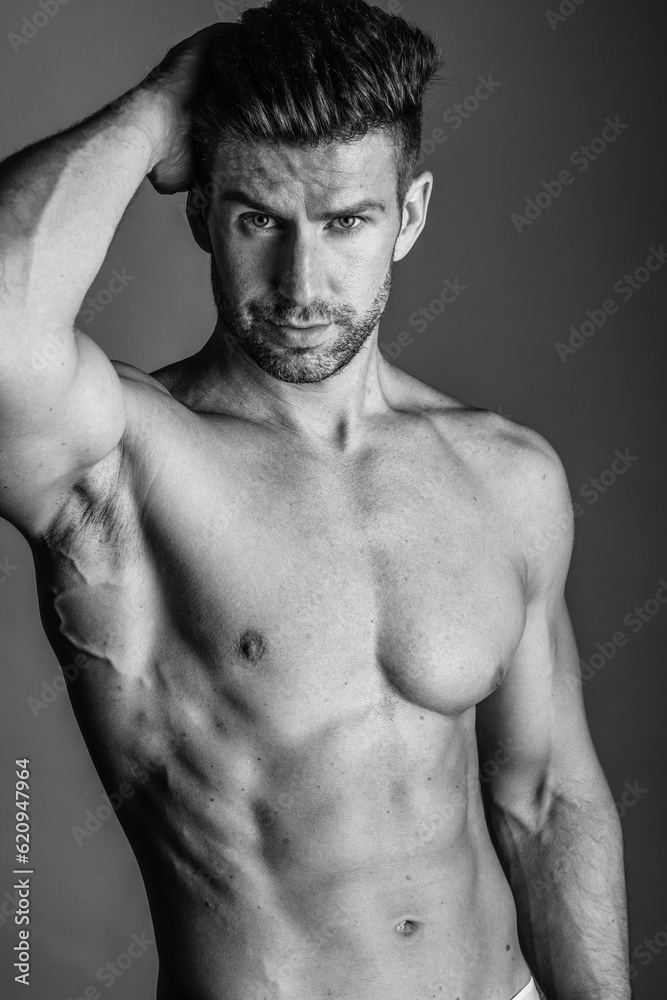 Black and white photo shoot of handsome man with perfect body. Black and white photo shoot of handsome man with perfect body.