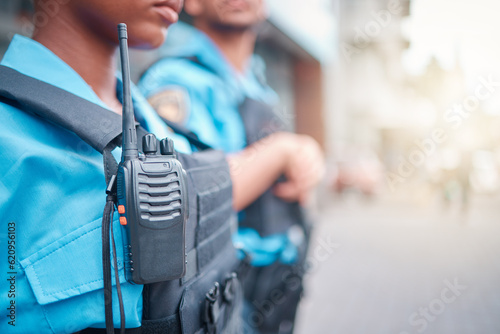 Carta da parati Radio, police and surveillance with a black woman officer standing outside while on patrol in the city