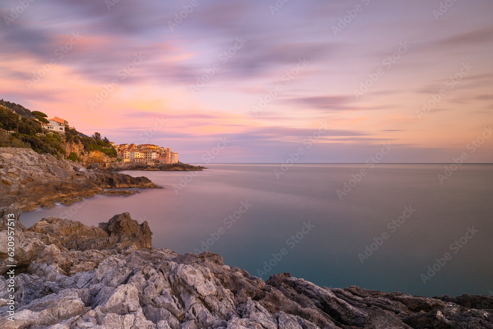 Long exposure to capture the sunset light near to Tellaro village, on a winter day, La Spezia province, Liguria district Long exposure to capture the sunset light near to Tellaro village, on a winter day, La Spezia province, Liguria district