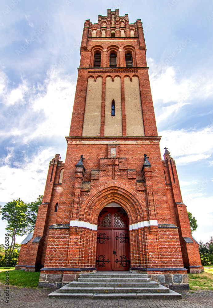 General view and architectural details of the Neo-Gothic Catholic Church of St. Joseph in Kobułty, Masuria, Poland.
